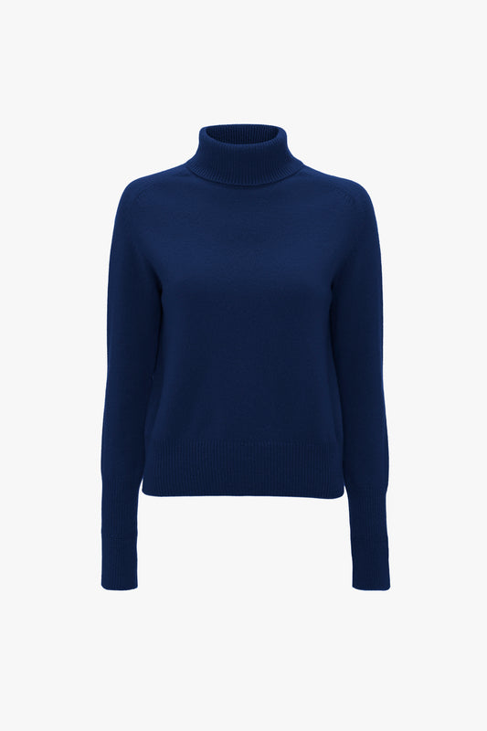 A Polo Neck Jumper In Navy by Victoria Beckham with long sleeves and a sophisticated saddle shoulder design, displayed against a white background.