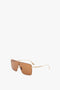 Rectangular Visor Gold-Framed Sunglasses with caramel lenses on a white background, featuring the Victoria Beckham logo.