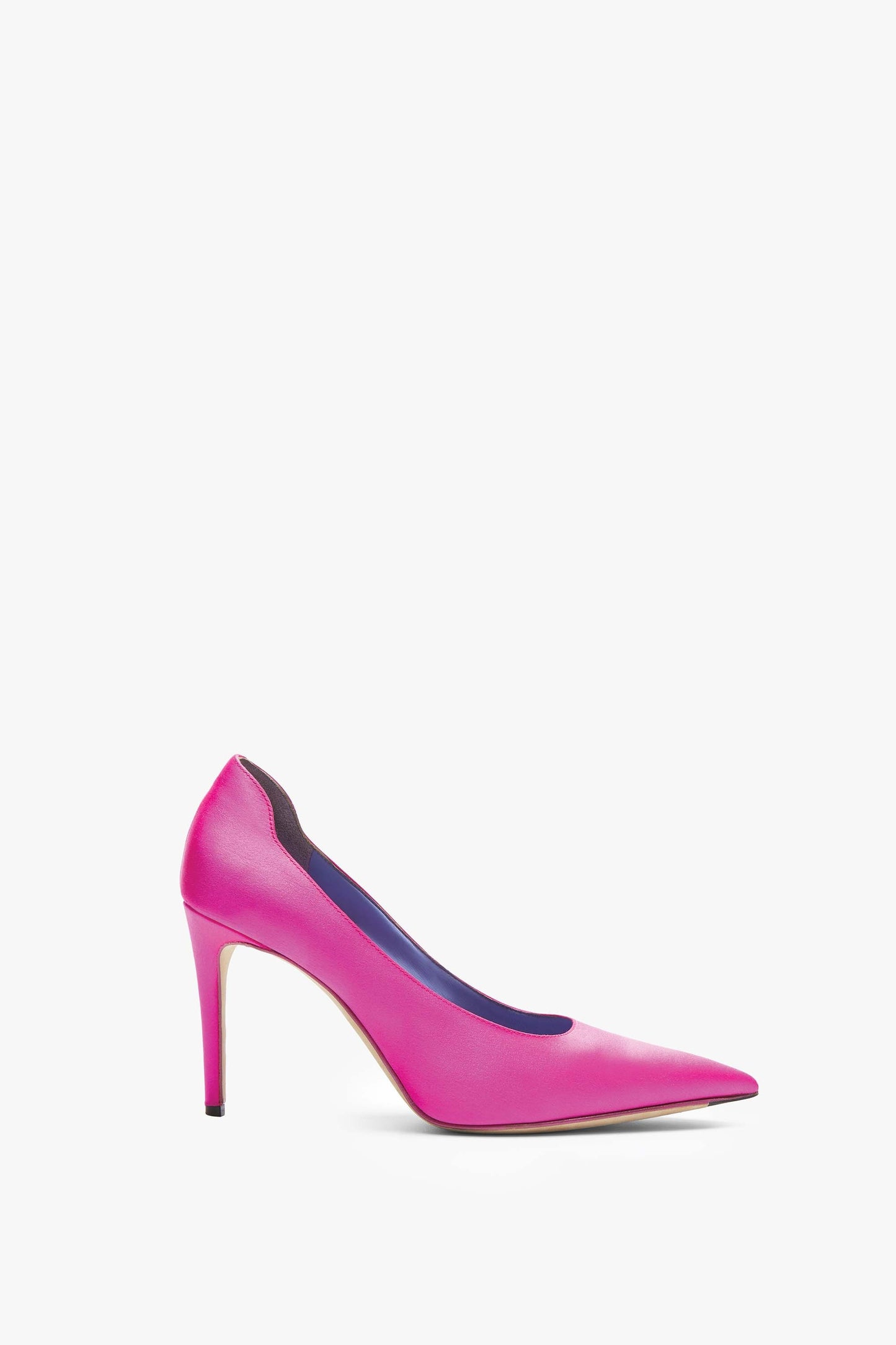 Single pink high-heeled shoe with a 90mm stiletto heel and pointed toe, featuring a contrasting blue and black interior. The VB 90 Pumps by Victoria Beckham are meticulously handcrafted in Italy.