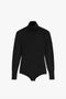 Poloneck Bodysuit In Black by Victoria Beckham in soft merino wool, featuring a subtle VB monogram on the left sleeve, displayed against a plain white background.