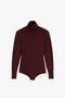 A long-sleeve, burgundy **Poloneck Bodysuit In Bordeaux** by **Victoria Beckham** on a white background.