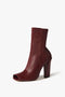 A single, Iona Boots In Dark Red high-heeled boot by Victoria Beckham, placed against a plain white background.