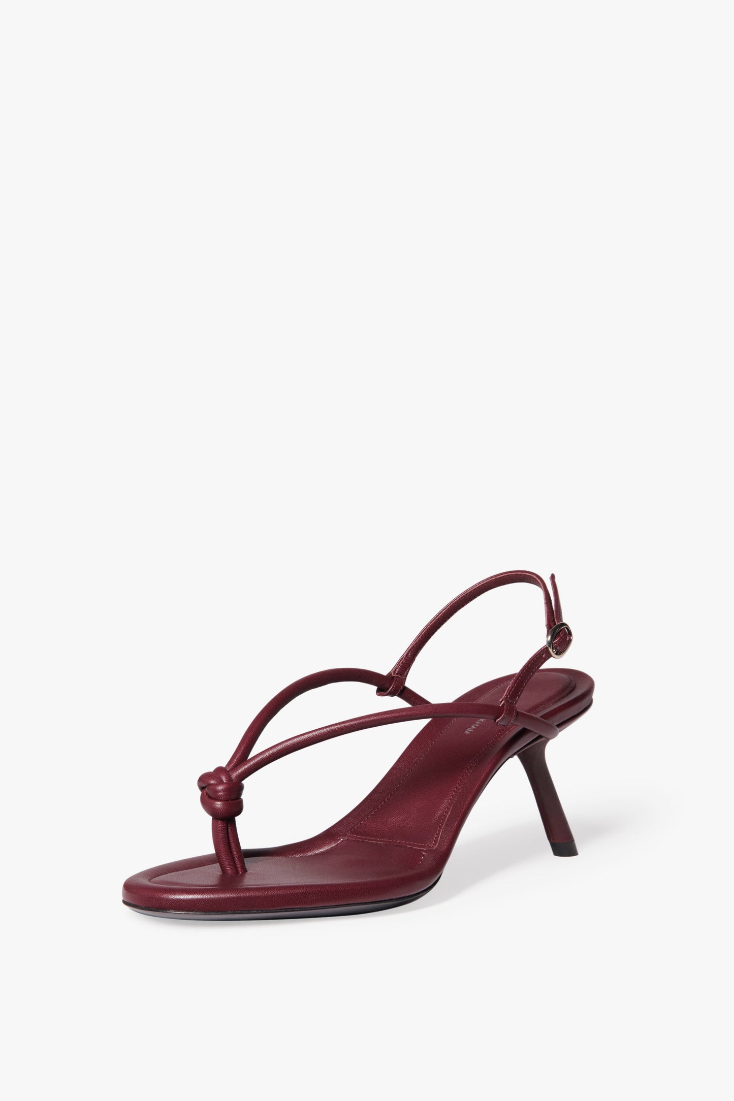 A single Victoria Beckham Estelle in Bordeaux high-heeled sandal, made from Bordeaux nappa leather, featuring a knotted toe post and strap design, set against a plain white background.