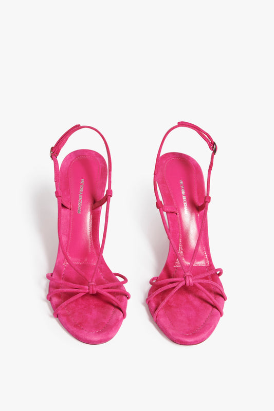 The Gaia Heeled Sandals from Victoria Beckham in fuchsia pink suede, for a barley there heel look.