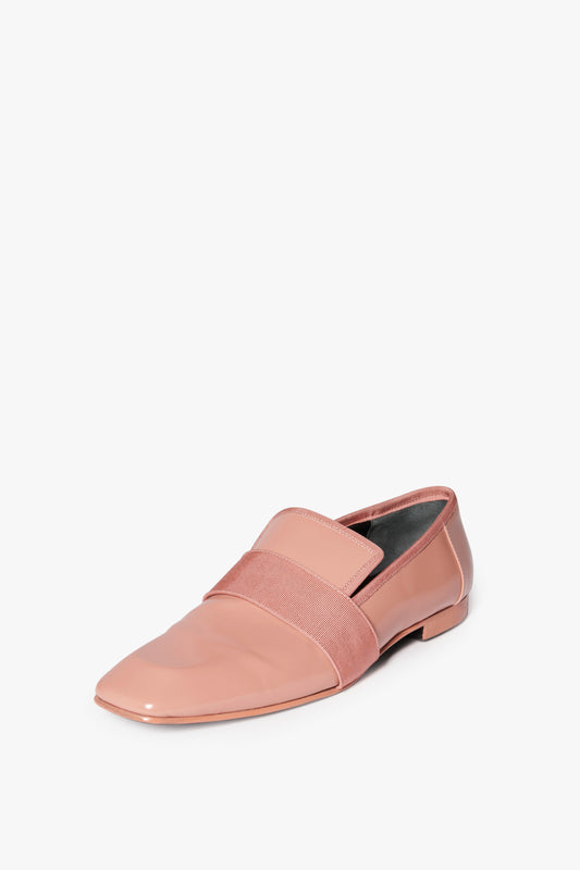 A single Debbie Loafer in Rose by Victoria Beckham with a square-toe design and a wide pink elastic band across the top, set against a plain white background.