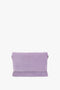 A Chain Pouch Bag with Strap in Lilac Suede by Victoria Beckham, with a rectangular shape and minimalistic design, crafted from tactile Italian leather, displayed against a white background.