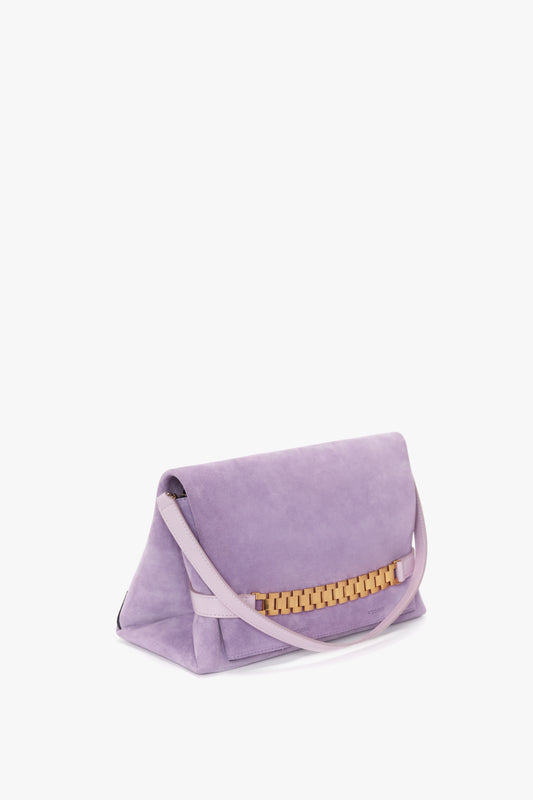 A Victoria Beckham Chain Pouch with Strap in Lilac Suede.