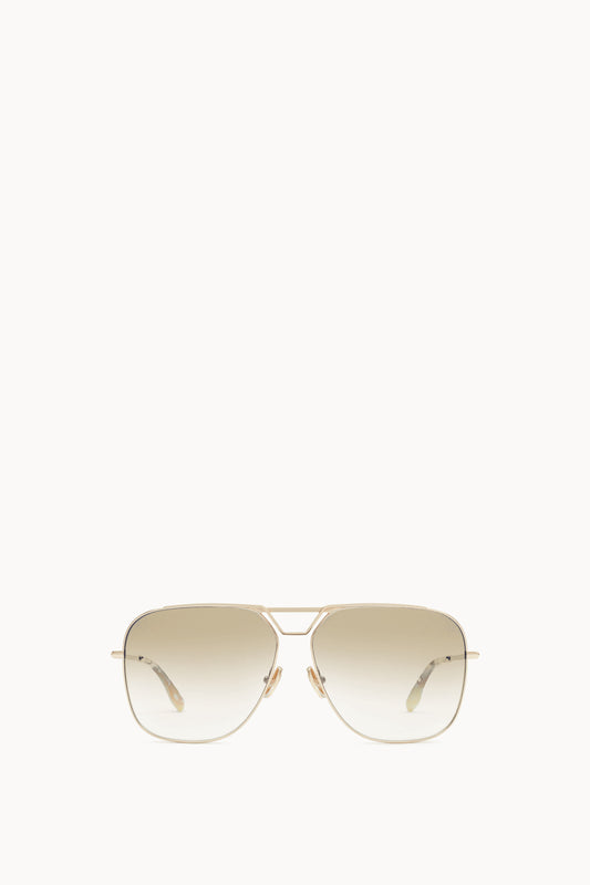 A pair of **Classic V Metal Navigator Sunglasses in Gold** by **Victoria Beckham**, displayed against a white background.