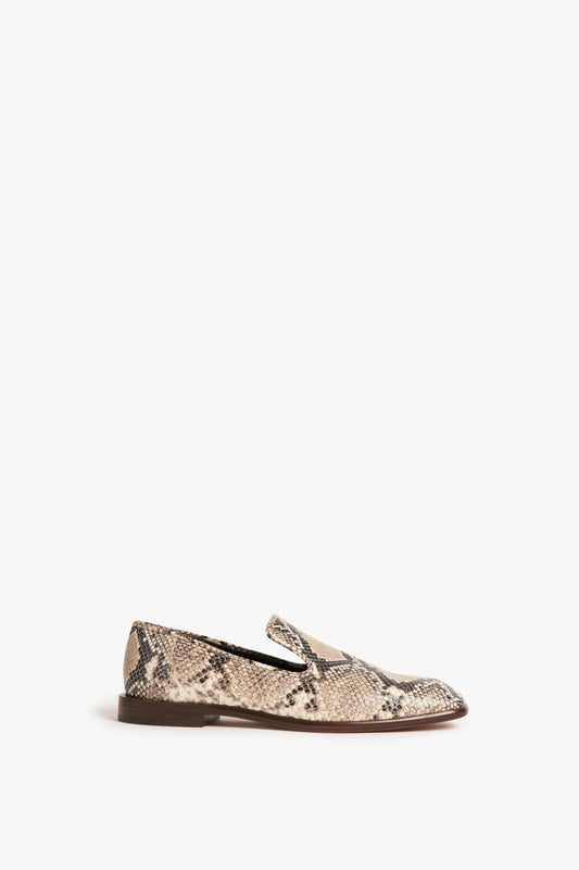 The classic Victoria Beckham Hanna Loafer in Beige Snake Print features a single brown and beige snakeskin-patterned design with a flat sole, elegantly displayed against a white background.