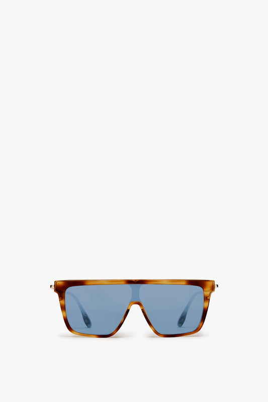 Rectangular Shield Sunglasses In Tortoise by Victoria Beckham feature blue lenses on a white background.
