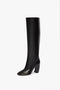 A single Capri Rise Boot 115mm in Black by Victoria Beckham with a rounded toe and a medium block heel on a white background.