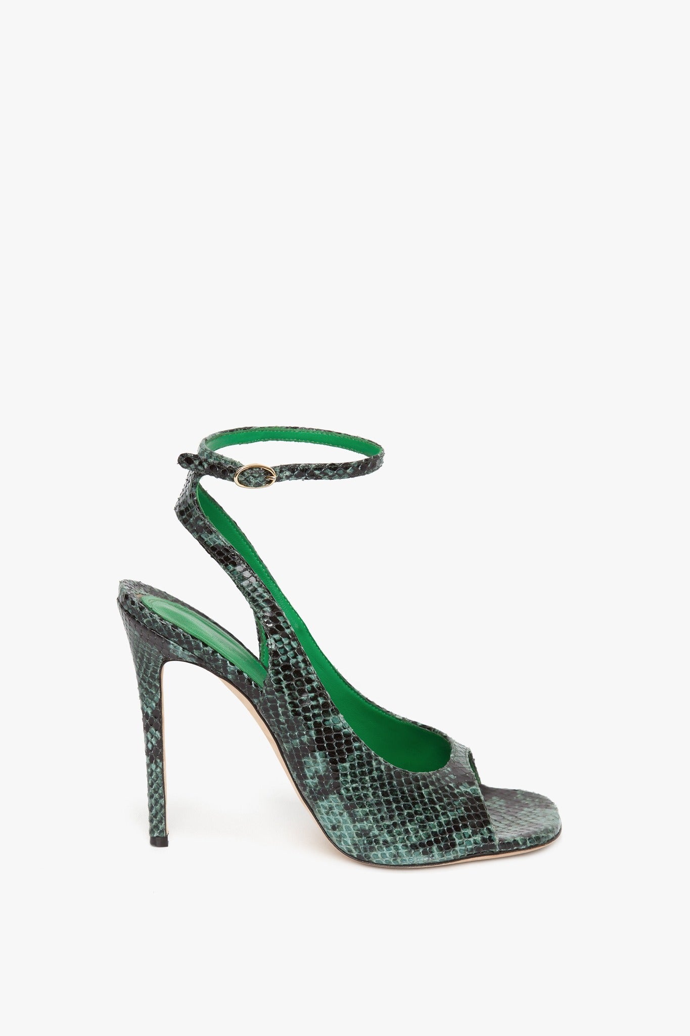 Introducing the Dawn Sandal in Petrol Green Printed Snakeskin: a green snake print high-heel shoe with an elegant ankle strap and buckle, displayed against a plain white background by Victoria Beckham.